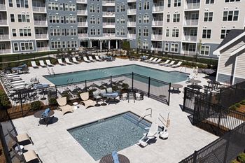 Pool surrounded by lounge chairs